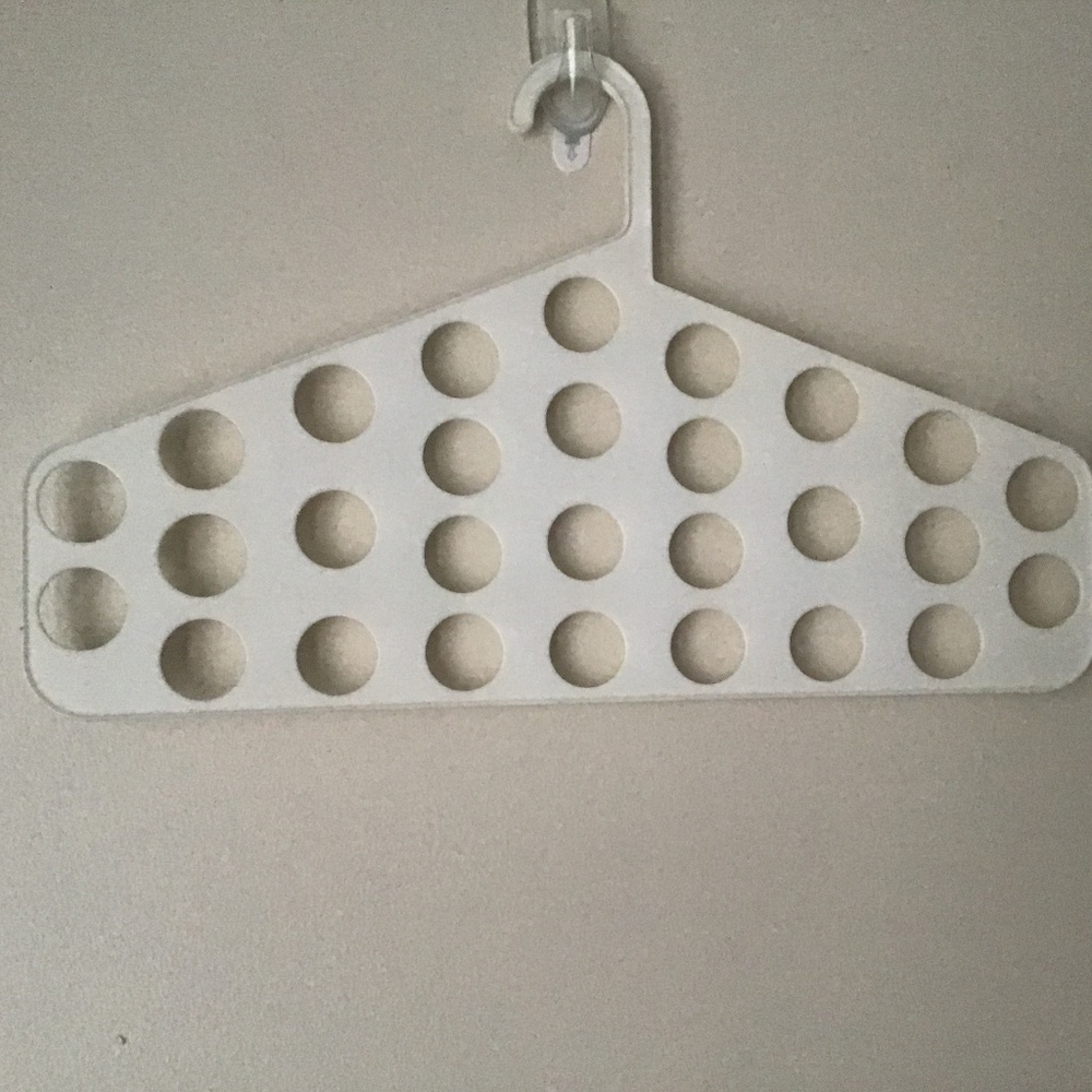 Closet hanger accessories holder